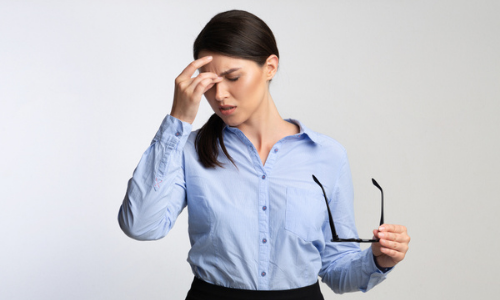 Woman suffering from ocular migraine 