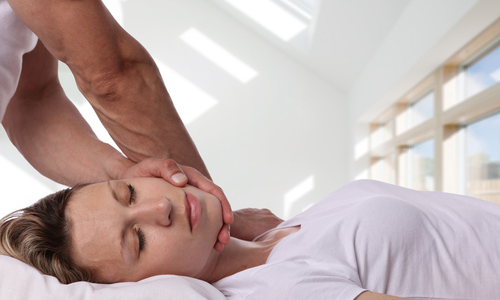 Woman getting neck adjustment 