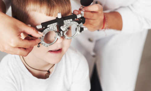 Little boy getting eye exam 