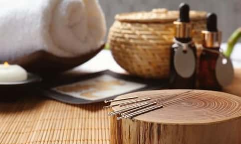 Acupuncture needles, oils, and towels