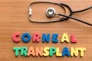 stethoscope and block letters spelling corneal transplant 
