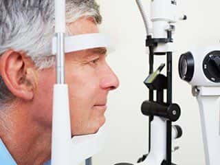 Image of a man getting an eye exam.
