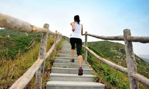 Woman jogging upstairs.