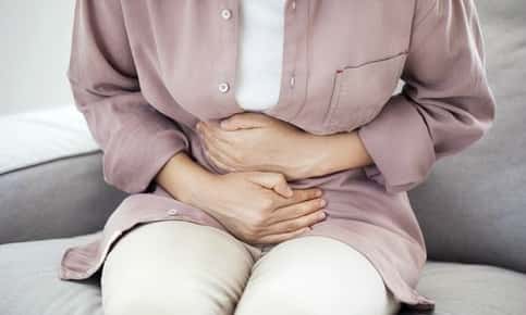 Woman experiencing stomach pain
