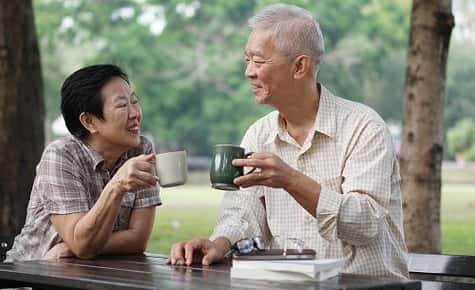 Image of a senior couple enjoying some tea. 