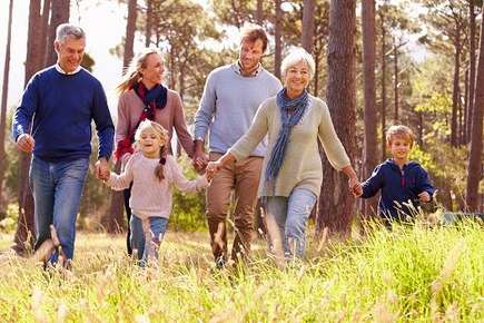 Image of a multigenerational healthy family hiking. 