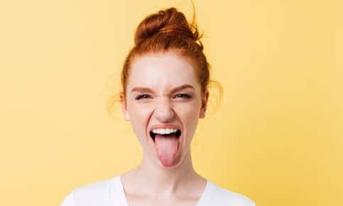 woman sticking out tongue 