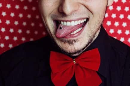 Image of a man with a tongue ring. 