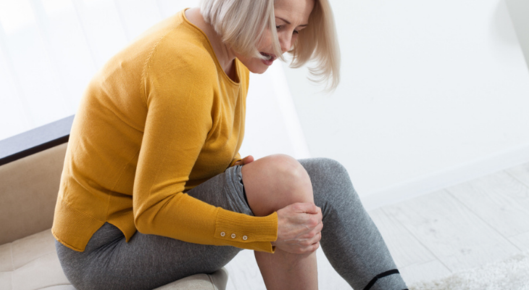 Woman experiencing pain in leg