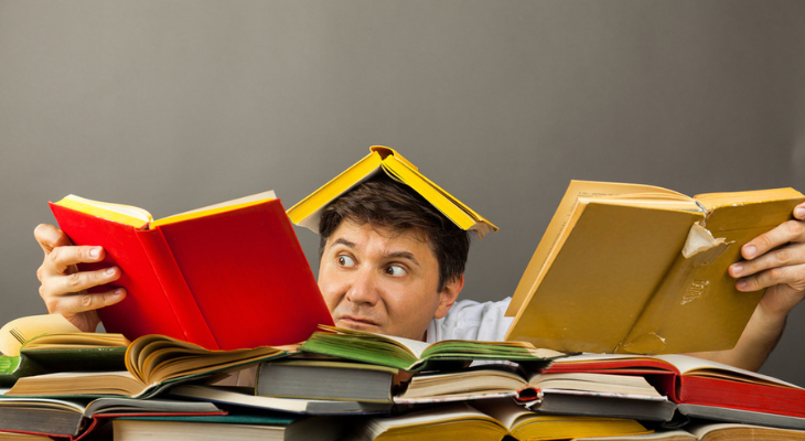 Man buried under books.
