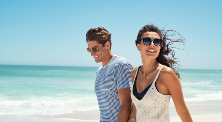 Couple on vacation wearing sunglasses