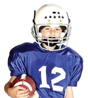 Child with mouthguard.