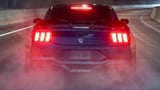 2024 Ford Mustang Dark Horse rear view smoking tires