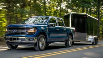 2024 Ford F-150 towing front view on road