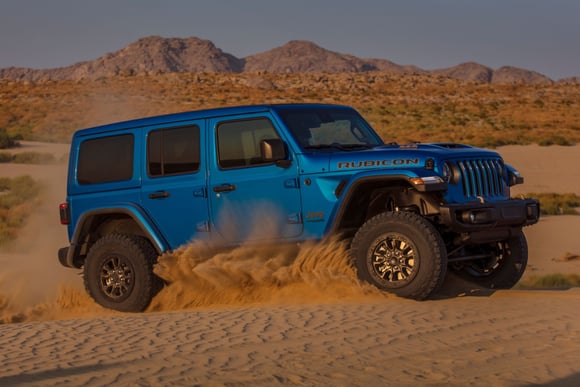 2023 Jeep Wrangler Rubicon 392 in blue off-road in sand