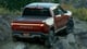 Rivian R1T electric truck red color rear view