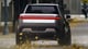 Rivian R1T electric truck silver color rear view