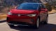 2024 Volkswagen ID.4 red color electric SUV front view on road