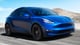 Tesla Model Y SUV blue color on track