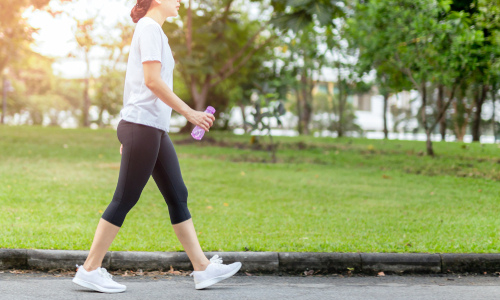 Woman walking through the park 