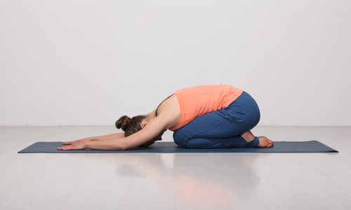 Woman doing child's pose