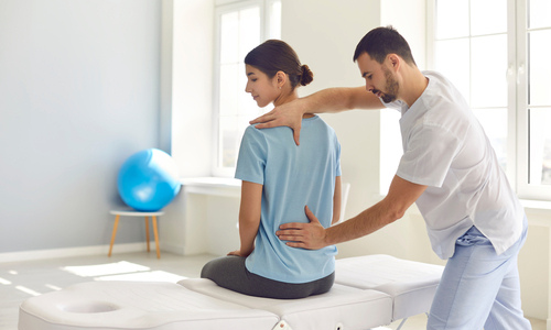 Woman receiving chiropractic treatment