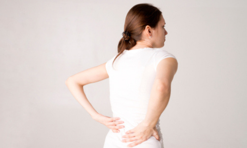 Woman suffering from back pain