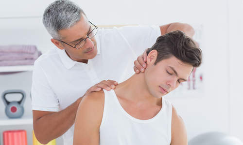 Man receiving a neck adjustment 