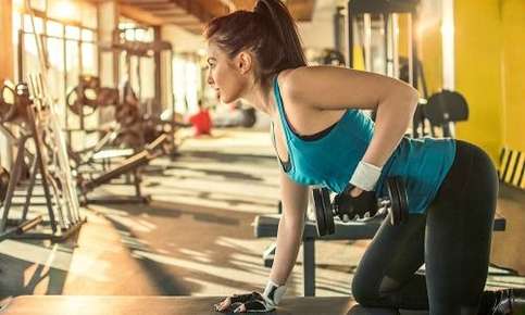 Woman weight training in the gym