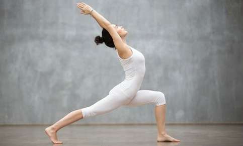 Woman standing in warrior one pose