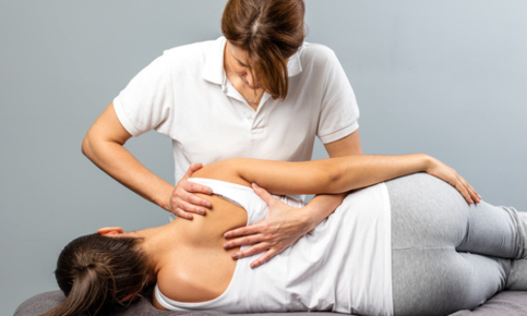 Woman receiving a chiropractic adjustment