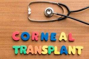 stethoscope and block letters spelling corneal transplant 