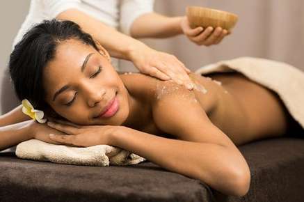 Image of a relaxed woman laying on a massage table.