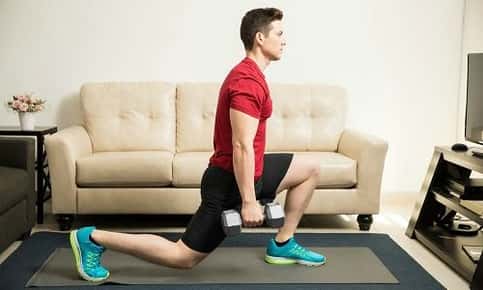 Man doing lunge in home