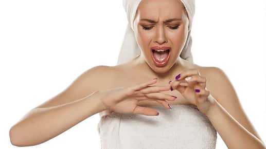 Image of an upset woman who broke her nail.
