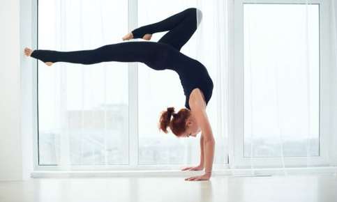 Woman doing an inverted yoga pose