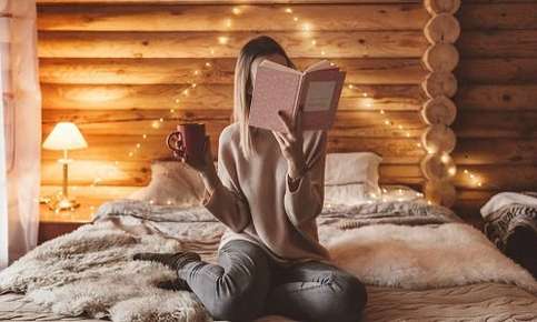 Woman reading on bed