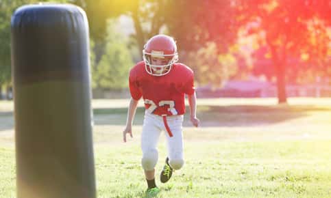 Boy in football gear.