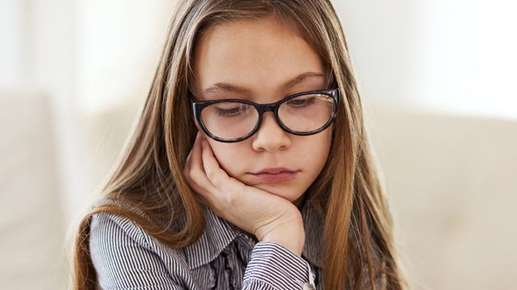 Image of a little girl wearing glasses.