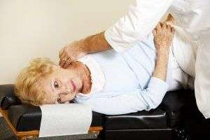 image of woman getting chiropractic adjustment.