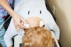 image of woman receiving electrotherapy.  
