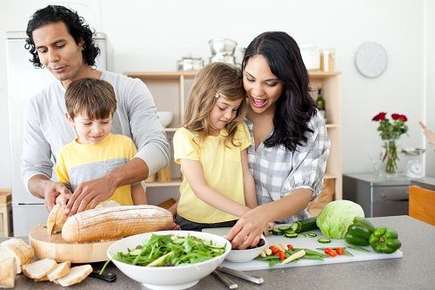 Image of family preparing food. 