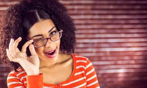 Image of woman wearing glasses winking. 