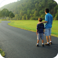 image of man and child walking together. 