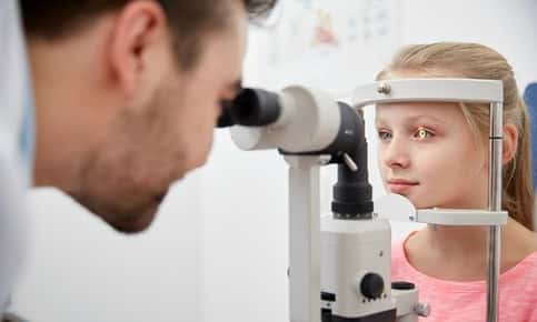 Young girl receiving eye exam