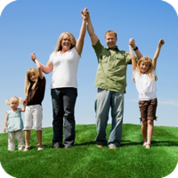 image of a happy family holding hands while raising their arms