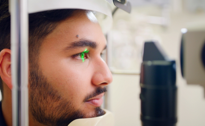 Man receives high tech eye exam.