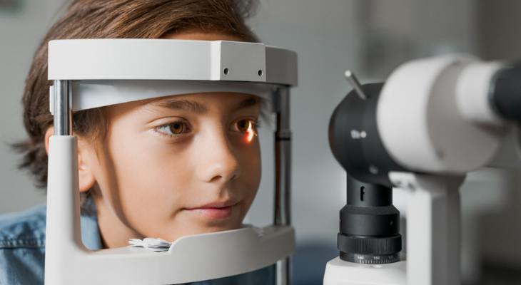 Young boy getting eye exam