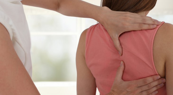 Woman receiving chiropractic care