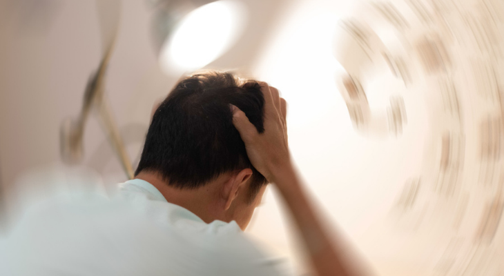 Man experiencing dizziness with head trauma